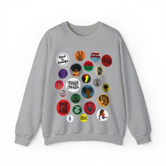 Sweatshirt with button-style designs celebrating Black culture, featuring phrases, symbols, and illustrations in a grid.