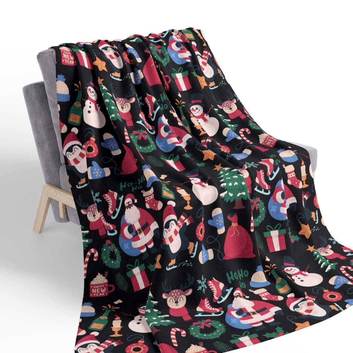 Christmas-themed blanket with colorful patterns draped over a chair on a white background